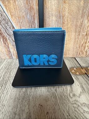 Michael Kors “Cooper” Men's Pebbled Leather Navy Wallet with Blue KORS Logo
